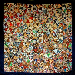 Kaleidoscope quilt with cat fabrics